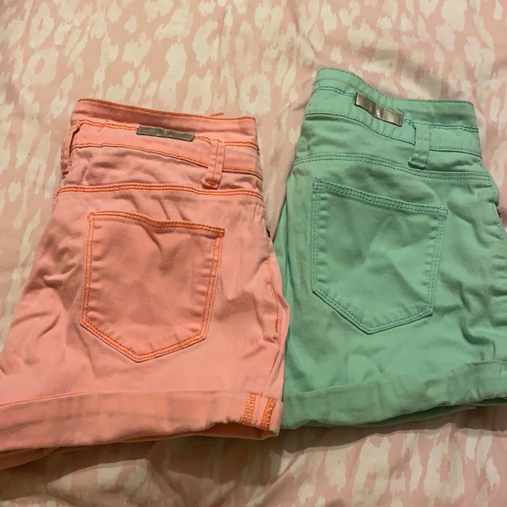 Two pairs of L.E.I high rise shorts.